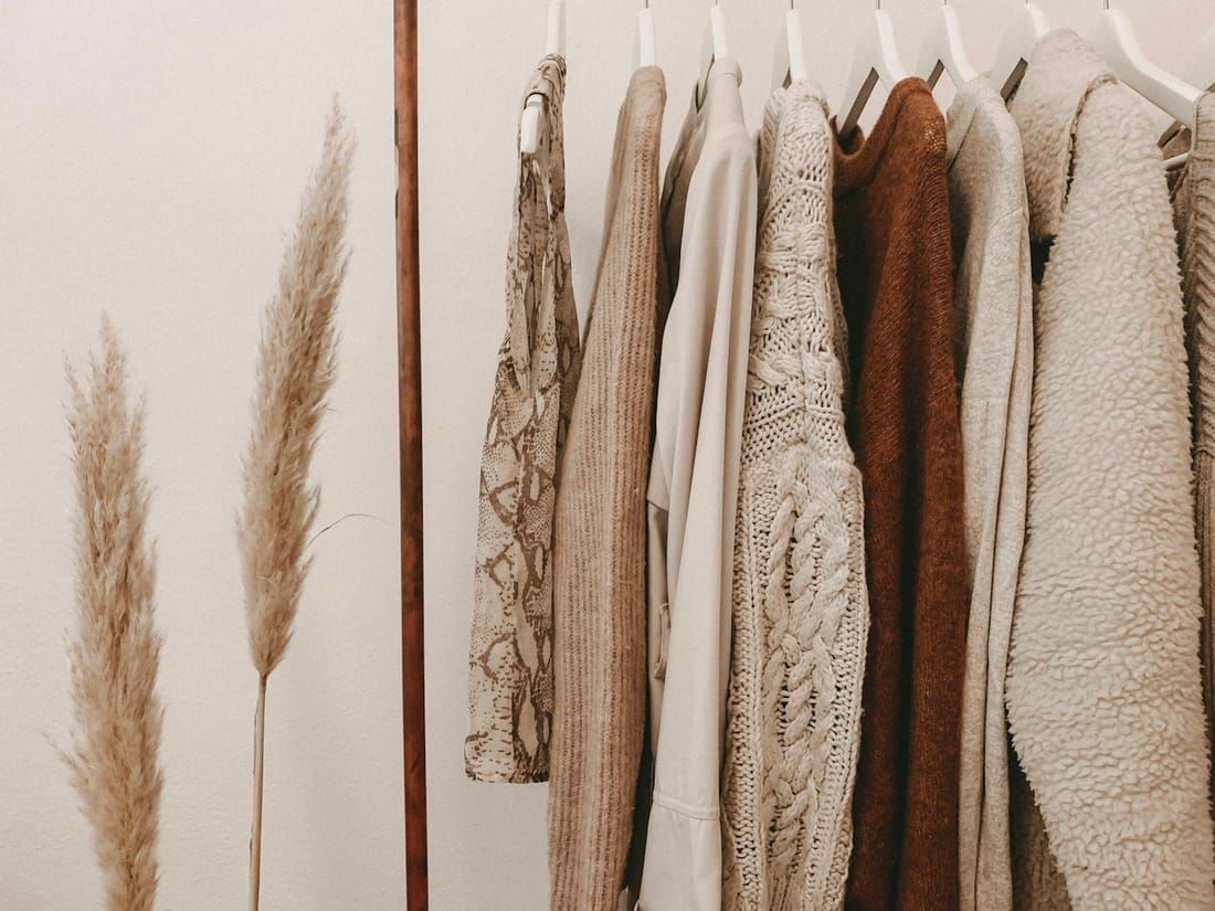 Hand-finished garments on a rail in a tailoring atelier