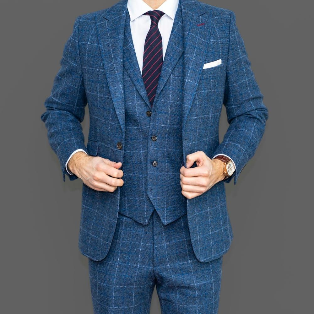 A tailored blue checked three-piece suit